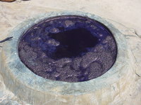 A pit filled with indigo dye