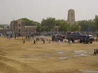 Firemen damping down the dust in front of the Emir's palace
