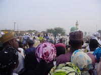 A group of royal horsemen with a crowd in front