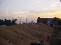 The crumbled remains of the city wall lead toward a gate