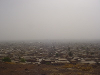 View across a city, visibility reduced by dust in the air