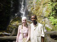 Eleanor standing with Laide in front of a small waterfall