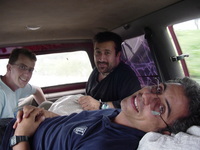 Me, Dave and Alex perched on the chicken feed sacks in the back of a car