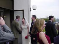 Andy and Therese standing outside the church with a crowd of people aroud them