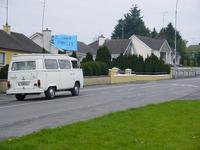 Therese and Andy leaving in a white VW camper, off up the road to Kingscourt