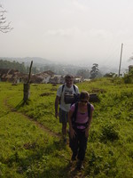 Amy and Pete walking uphill toward the camera