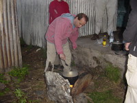 Jonathan cooking over an open fire