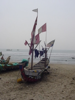 A fishing boat decorated with flags.