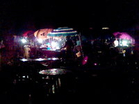 Grilled fish stalls in the rain at Abacha barracks