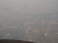 Looking down on a small town with dirt roads