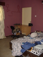 Picture of my bedroom, showing the bed and desk