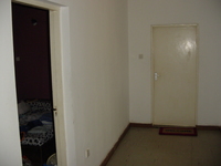 Picture of the hall, showing the doors to the two bedrooms