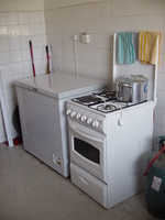 Picture of the kitchen, showing the cooker and freezer