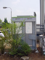 A pair of phone kiosks on a street in Abuja