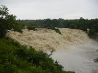Gurara Falls, torrents of white foamy water pounding over the rocks