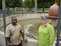 David and Monique standing in front of a pond