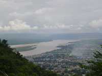 Two rivers join, with a town in the foreground.