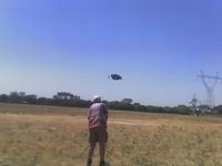 Me holding kite handles, the kite is visible directly in front of me.