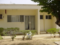 The front of a building with double doors and windows