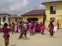 Group in pink outfits dancing 
