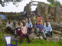 A group of people sitting on stone steps.