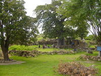 Trees and grass, with small stone structures