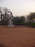 A sign with several of the arms pointing at the ground