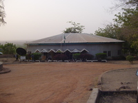 A large round building in ugly grey concrete