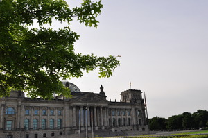 An old stone building topped with a metal and glass hemispherical dome.