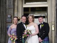The bridal party on the steps of the hotel