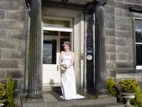 The bride on the steps of the hotel