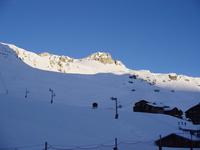 Picture of mountains with their tops lit by the sun