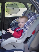 Joseph strapped into a car seat in the back of a Citroen Xsasa Picasso