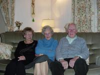 Picture of my Great Aunt Daphne, Granny and Grandpa sitting in my Grandparents' living room on Boxing Day